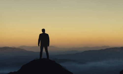 Jim Bolger overlooking the Arizona desert at sunrise, symbolizing clarity, investor strategy, and a new path in real estate